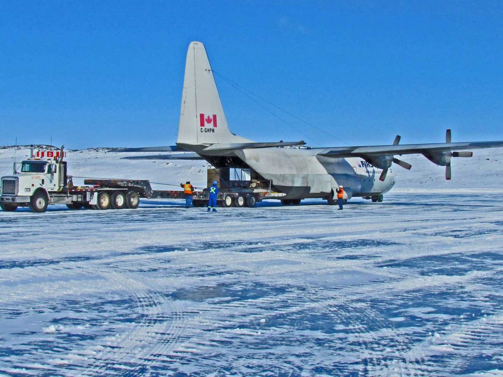Large aircraft unloading Geotech equipment